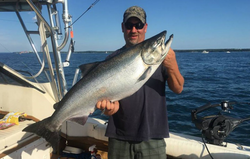 Get hooked on Oswego’s Salmon fishing charm!